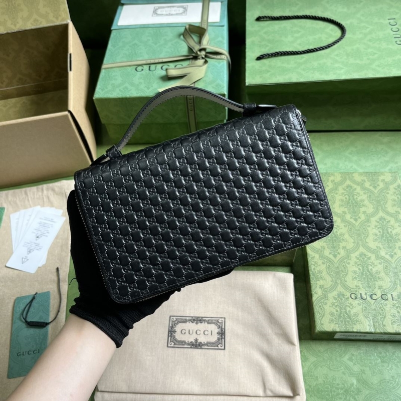 G*u*i clutch bags